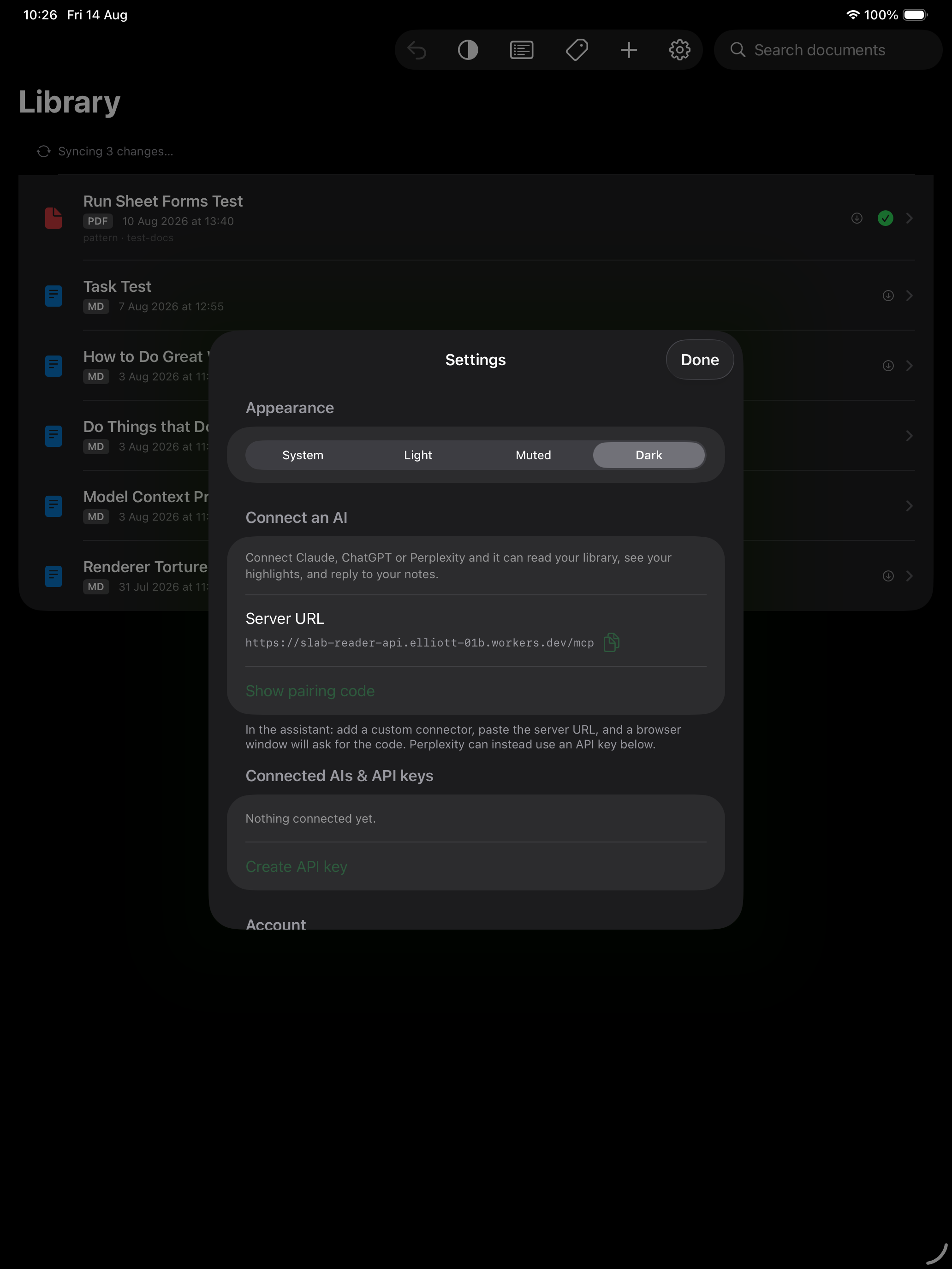 Slab Reader's Connect an AI settings screen showing the server URL and pairing code